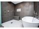 Modern bathroom features a glass shower, tiled floors, and separate soaking tub at 294 Clearview Ct, Villa Rica, GA 30180