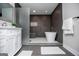 Modern bathroom with shower featuring gray tile, a glass partition, rain shower head, and a white soaking tub at 294 Clearview Ct, Villa Rica, GA 30180