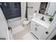 Bathroom with white vanity, dark fixtures, and a bath/shower combo with tiled walls at 294 Clearview Ct, Villa Rica, GA 30180