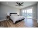 A beautifully styled primary bedroom boasts a ceiling fan and sliding glass doors at 294 Clearview Ct, Villa Rica, GA 30180