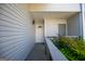 A covered townhome entry features wood-look porch and white door with sidelight at 294 Clearview Ct, Villa Rica, GA 30180