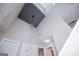 Bright foyer featuring high ceilings, geometric lighting and stairs to the second floor at 294 Clearview Ct, Villa Rica, GA 30180