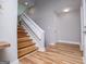 A home foyer featuring wood-look floors, stairs to the second floor and contemporary light fixtures at 294 Clearview Ct, Villa Rica, GA 30180