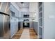 Updated kitchen with stainless steel appliances, gray cabinets, stylish backsplash, and hardwood floors at 294 Clearview Ct, Villa Rica, GA 30180