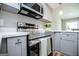 Stylish kitchen features stainless steel appliances, sleek cabinetry, and modern countertops at 294 Clearview Ct, Villa Rica, GA 30180
