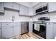 Contemporary kitchen with stainless steel appliances, granite countertops, and modern cabinetry at 294 Clearview Ct, Villa Rica, GA 30180