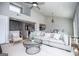 Bright, open-concept living room featuring a large couch, stylish coffee table, and views into the kitchen at 294 Clearview Ct, Villa Rica, GA 30180