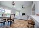 Open-concept living and dining area filled with natural light from large windows with views of the lake at 294 Clearview Ct, Villa Rica, GA 30180