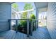 Covered porch with gray wood-look floor boards and decorative horizontal cable railing at 294 Clearview Ct, Villa Rica, GA 30180