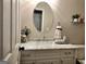Bathroom with a white vanity, a marble countertop, and an oval mirror at 247 Water Oak Ln, Jonesboro, GA 30238