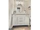Bathroom with a white vanity, an oval mirror, and modern lighting at 247 Water Oak Ln, Jonesboro, GA 30238