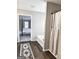 Bathroom with tub, shower, and neutral-toned walls, adjoins the spacious primary bedroom at 247 Water Oak Ln, Jonesboro, GA 30238
