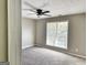 This is a nice bedroom with a ceiling fan and a window to let in the light at 247 Water Oak Ln, Jonesboro, GA 30238