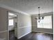 Dining room with chandelier, hardwood floors and natural light at 247 Water Oak Ln, Jonesboro, GA 30238