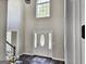 Front door entrance with a two-story ceiling and a view of the staircase at 247 Water Oak Ln, Jonesboro, GA 30238