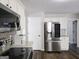 Bright kitchen features stainless steel appliances, granite counters, and white cabinetry at 247 Water Oak Ln, Jonesboro, GA 30238