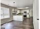 Open kitchen with white cabinets, a granite countertop, and stainless steel appliances at 247 Water Oak Ln, Jonesboro, GA 30238