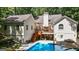A backyard featuring a deck, an outdoor kitchen, a patio area and a swimming pool at 3644 Graycliff Rd, Snellville, GA 30039