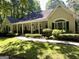 Charming one-story home with a covered front porch and well-maintained landscaping at 3644 Graycliff Rd, Snellville, GA 30039