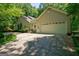 Spacious three-car garage and extra parking on a wide driveway at 3644 Graycliff Rd, Snellville, GA 30039