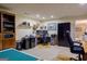 Large office featuring a built-in bookcase, desk with computer, and overhead lighting at 3644 Graycliff Rd, Snellville, GA 30039