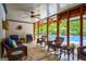 Covered patio with ample seating adjacent to the swimming pool at 3644 Graycliff Rd, Snellville, GA 30039