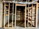 Spacious unfinished basement with wood framing, shelving, and visible ductwork at 6680 Bentley Trl, Cumming, GA 30040