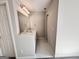 Bright bathroom with white tile floors and a white double sink vanity at 6680 Bentley Trl, Cumming, GA 30040