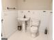 Charming half bathroom with white beadboard, pedestal sink, and elegant fixtures at 6680 Bentley Trl, Cumming, GA 30040