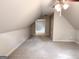 Bonus room with vaulted ceiling and neutral walls and carpet at 6680 Bentley Trl, Cumming, GA 30040