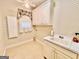 Practical laundry room with built-in cabinets and sink at 6680 Bentley Trl, Cumming, GA 30040