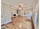 Spacious living room with hardwood floors, fireplace, built-in shelves and decorative tray ceiling at 6680 Bentley Trl, Cumming, GA 30040