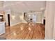 Open-concept living room with hardwood floors and fireplace at 6680 Bentley Trl, Cumming, GA 30040