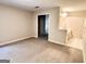 Large main bedroom with an ensuite bathroom and neutral carpet flooring at 6680 Bentley Trl, Cumming, GA 30040