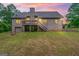 Home with an elevated deck, walkout basement, and level yard at 1233 Butler Bridge Rd, Mcdonough, GA 30252