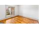 Bright bedroom with hardwood floors and a large window with natural light at 1233 Butler Bridge Rd, Mcdonough, GA 30252