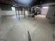 Spacious unfinished basement with concrete flooring and access for plumbing at 1329 Springwood Nw Dr, Conyers, GA 30012