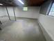 Unfinished basement provides ample space and natural light with concrete flooring at 1329 Springwood Nw Dr, Conyers, GA 30012