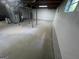 Large unfinished basement with concrete flooring and white painted cinder block walls at 1329 Springwood Nw Dr, Conyers, GA 30012