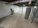 Unfinished basement with water heater and what appears to be a water filtration system at 1329 Springwood Nw Dr, Conyers, GA 30012