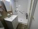 Bathroom features a modern sink and tiled shower at 1329 Springwood Nw Dr, Conyers, GA 30012