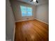 Bedroom features hardwood floors, ceiling fan and closet at 1329 Springwood Nw Dr, Conyers, GA 30012