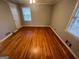 This bedroom features hardwood floors and a window with natural light at 1329 Springwood Nw Dr, Conyers, GA 30012