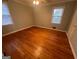This bedroom features hardwood floors and a window with natural light at 1329 Springwood Nw Dr, Conyers, GA 30012