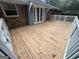 Inviting deck with painted white railings and French doors, perfect for outdoor entertaining and relaxation at 1329 Springwood Nw Dr, Conyers, GA 30012