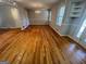 Spacious dining area with hardwood floors, classic chandelier, large windows, and neutral paint scheme at 1329 Springwood Nw Dr, Conyers, GA 30012