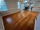 Open dining area featuring hardwood floors, French doors, and a view of the kitchen at 1329 Springwood Nw Dr, Conyers, GA 30012