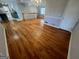 Spacious area showcasing the hardwood floors and open floor plan at 1329 Springwood Nw Dr, Conyers, GA 30012