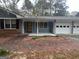 A beautiful home with a brick walkway, a blue facade, and a front porch at 1329 Springwood Nw Dr, Conyers, GA 30012