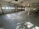 Bright and open garage with multiple doors, offering ample parking or workspace at 1329 Springwood Nw Dr, Conyers, GA 30012